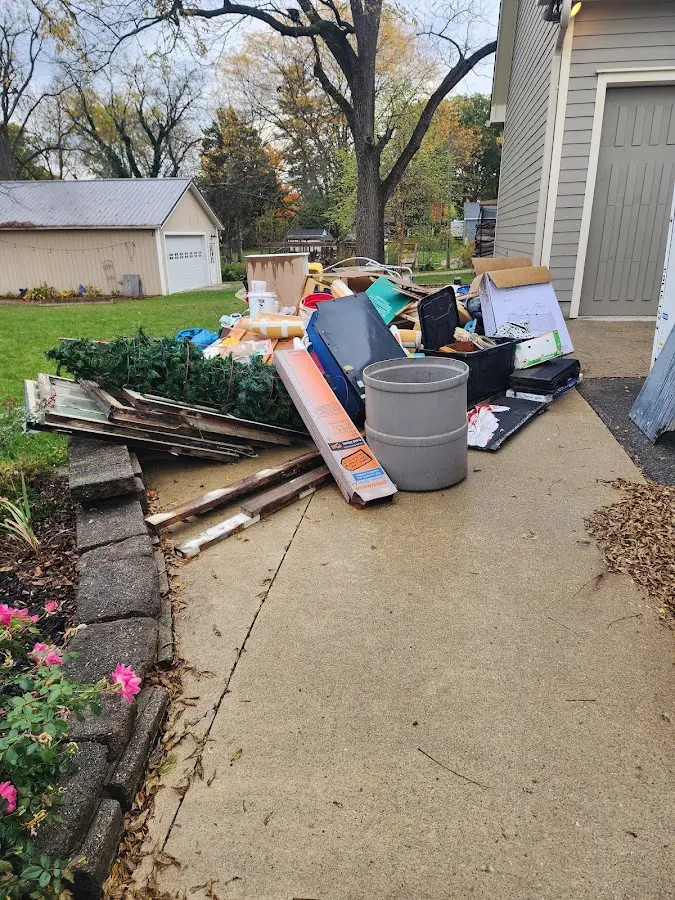 Dumpster being loaded with debris for 30 Yard Dumpster Rental in McNair